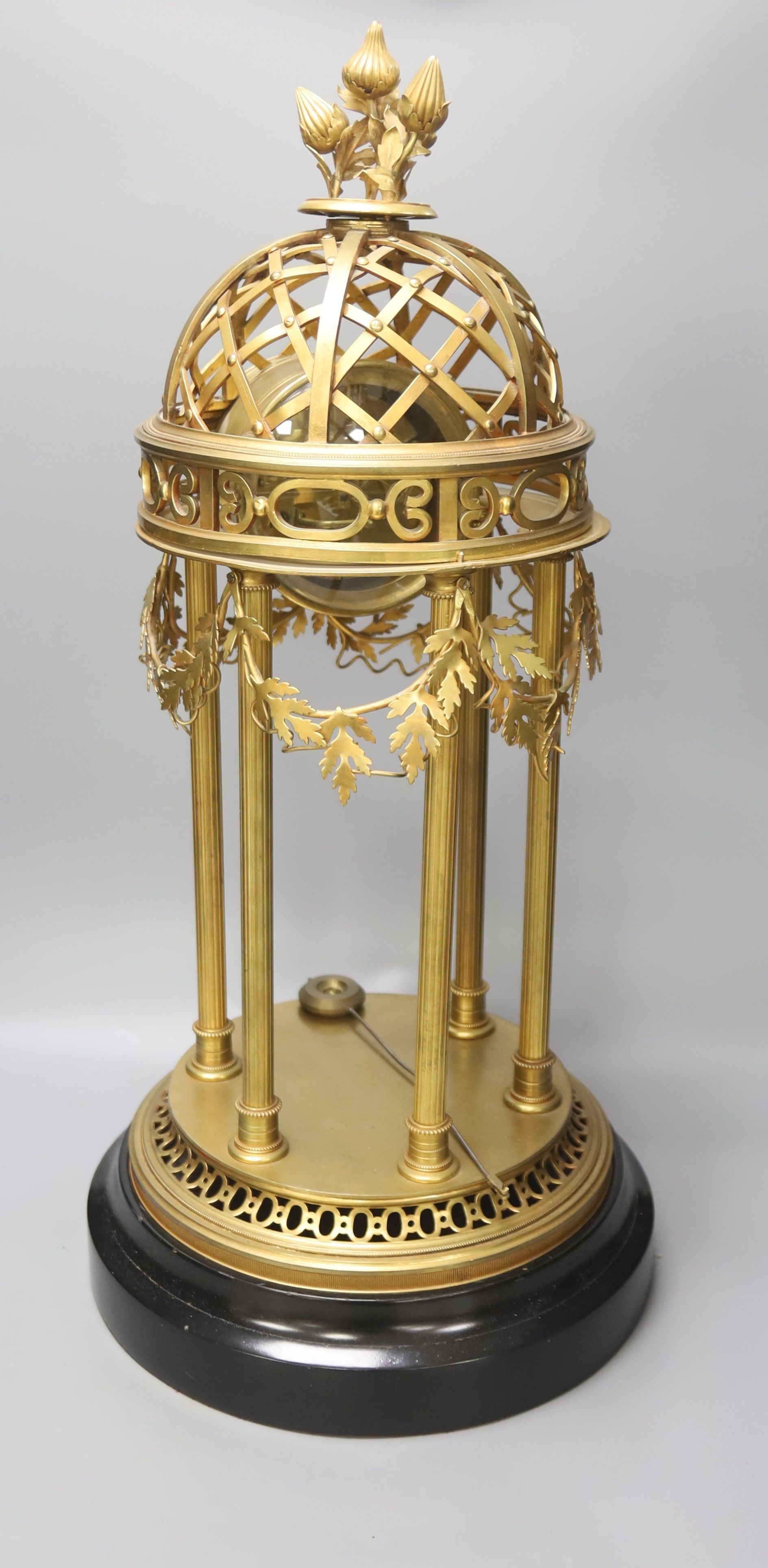 A large gilt metal Portico mantel clock, with slate and rouge marble dial, height 61cm